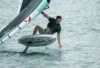 Wing foil rider downwinding on open Baltic Sea water